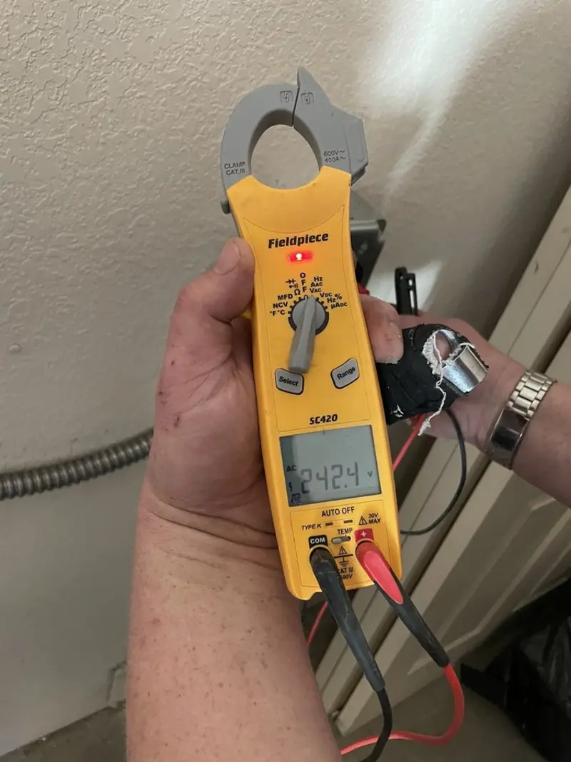 Voltage testing with clamp meter during Generator Installation in East Los Angeles